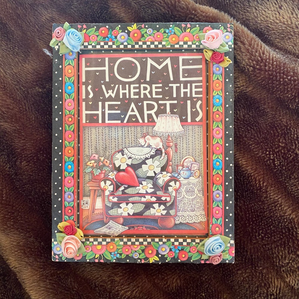 Mary Engelbreit Home Is Where The Heart Is Framed Print